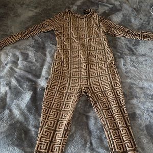 Used black and gold sparkles jumpsuit size XL